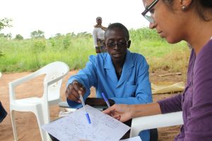 Ben - a recently trained Community Health Worker explains his village route map for home visits