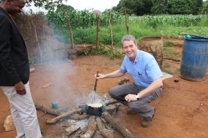 Stirring a pot of the staple maize porridge "nshima" in a village near Monze